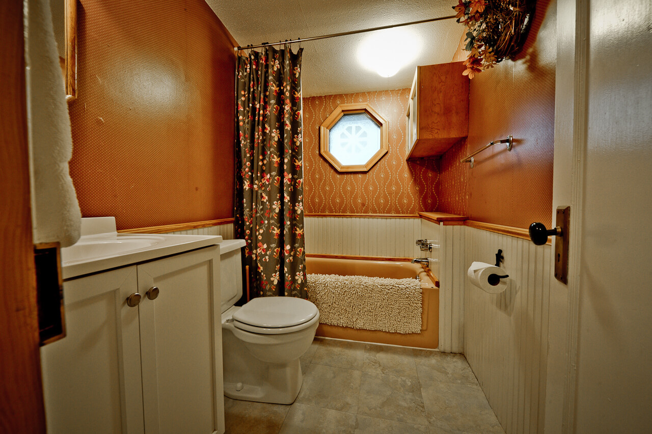 Bathroom with orange and white walls