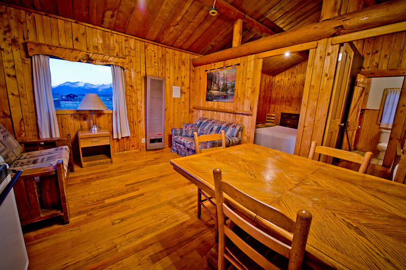 Wooden cabin interior with view of mountains