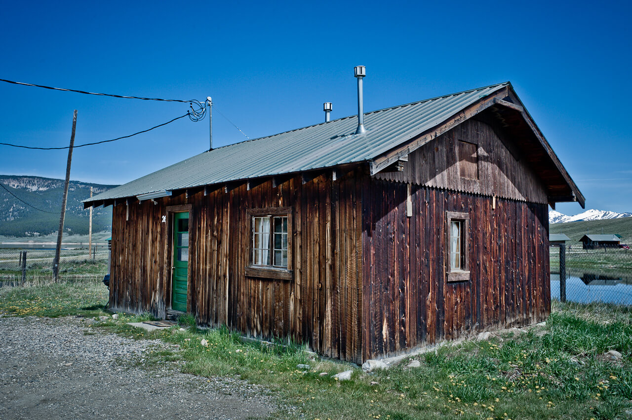 Wooden cabin with green doors