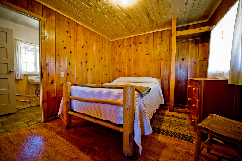 Wooden cabin bedroom with single bed