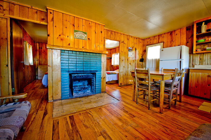 Wooden cabin interior with fireplace