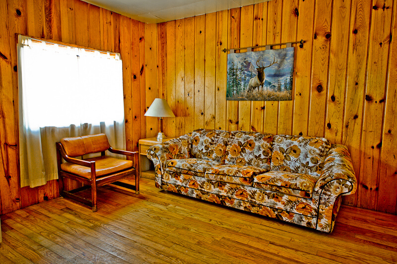 Wooden cabin with floral sofa