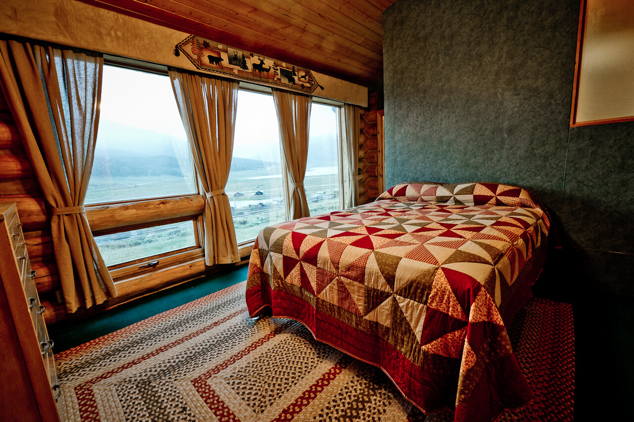 Bedroom with a row of windows
