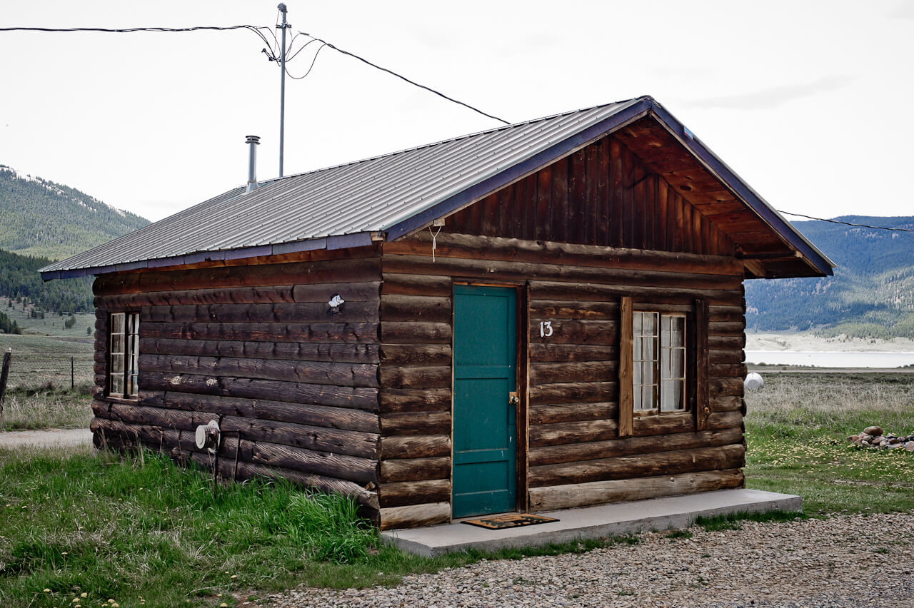 Wooden cabin with green door