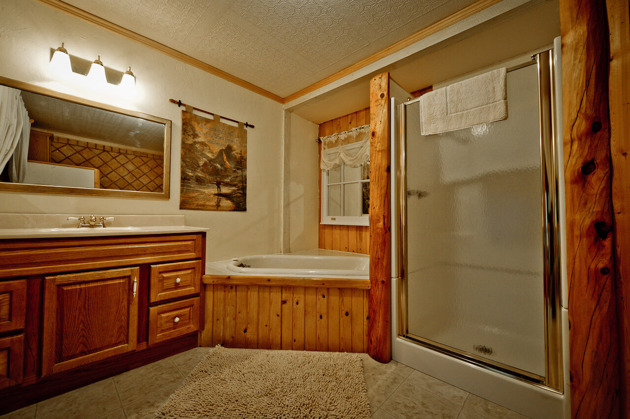Wooden bathroom with bathtub