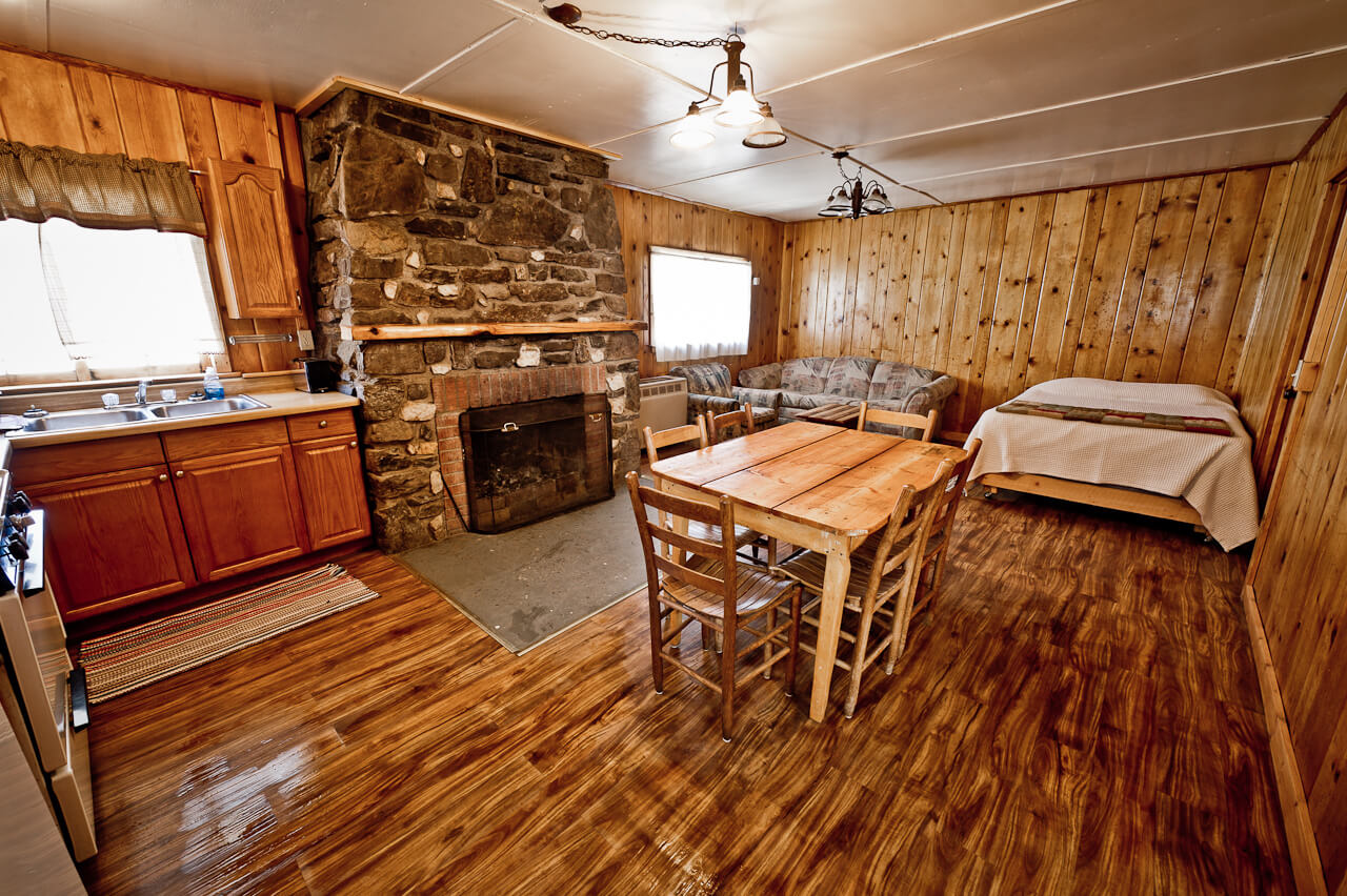 Wooden cabin interior with fireplace